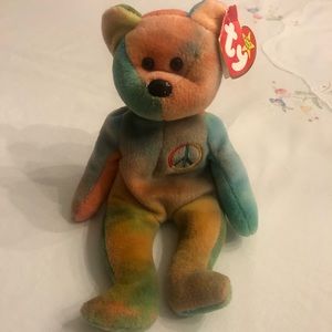 Peace beanie baby.  PVC.  Good condition with tags